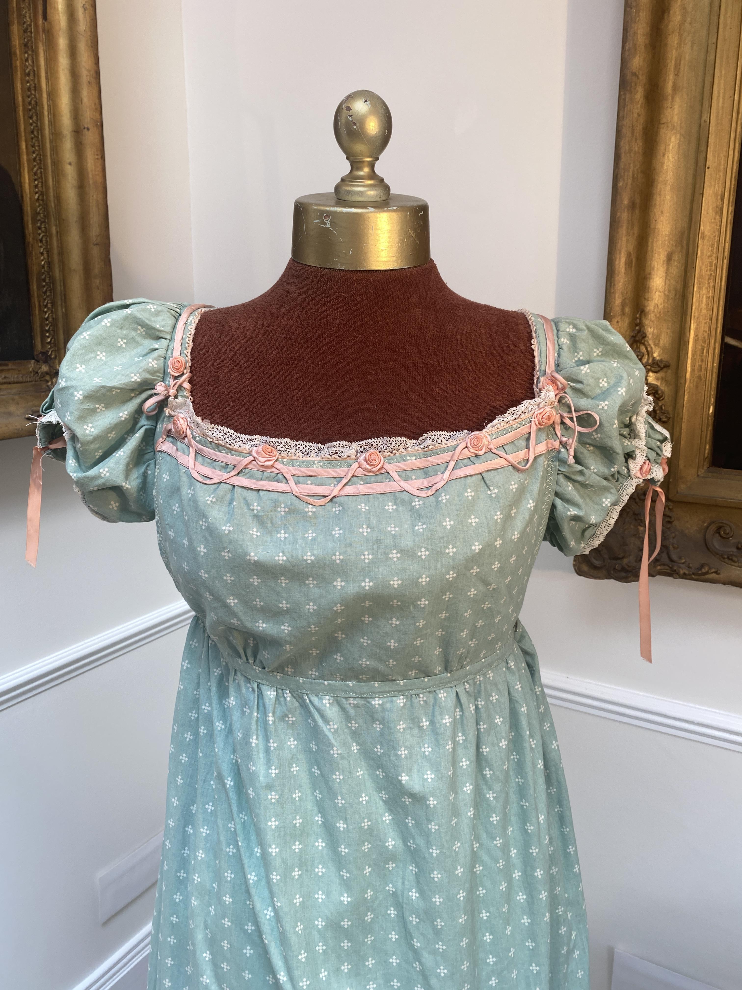 A green patterned cotton Regency style day-dress. Size 12 to 16